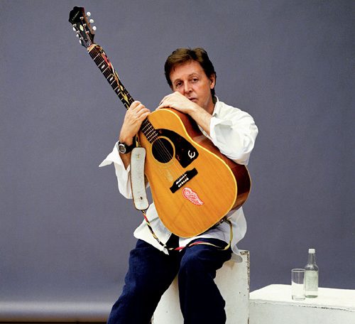 paul mccartney playing guitar