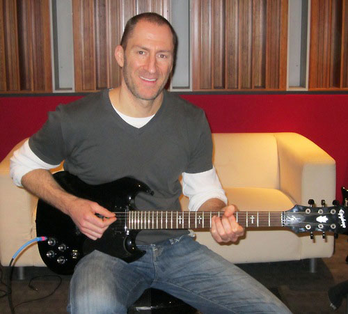 Cash Cab's Ben Bailey Rocks With An Epiphone Tony Iommi G-400